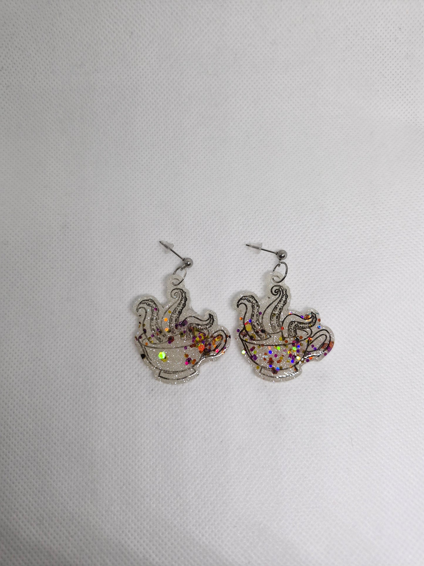 Kraken In a Cup dangle holographic white glitter dangle earrings