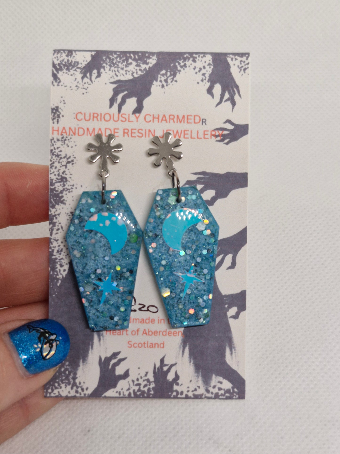 Blue Glitter Coffin and star dangle earrings